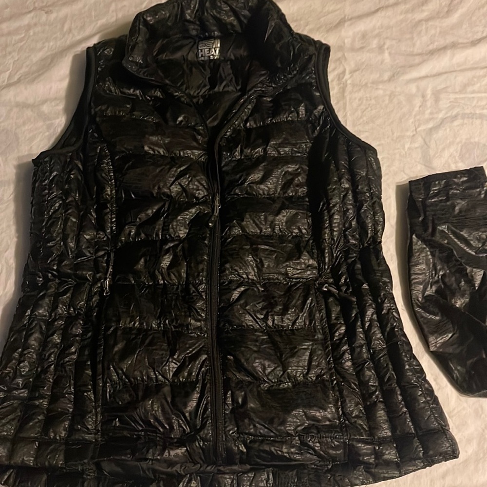 Black 32 Degree heat down quilted insulation vest packable with bag.